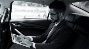 THINKLimo Executive working in car